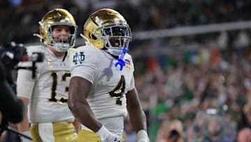 Jan 9, 2025; Miami, FL, USA; Notre Dame Fighting Irish running back Jeremiyah Love (4) celebrates a touch down in the second half against the Penn State Nittany Lions in the Orange Bowl at Hard Rock Stadium. Mandatory Credit: Sam Navarro-Imagn Images