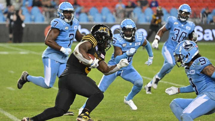 Ontario, CAN: Hamilton Tiger-Cats running back James Butler (9) runs with the ball against the Toronto Argonauts. Mandatory Credit: Dan Hamilton-USA 