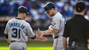 Aug 30, 2025; New York City, New York, USA; Miami Marlins outfielder Jakob Marsee (87) is greeted by first base coach Tyler Smarslok (31) after hitting a RBI single against the New York Mets during the third inning at Citi Field.