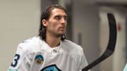 Apr 1, 2024; San Jose, California, USA;  Seattle Kraken left wing Brandon Tanev (13) prepare for warmups before the start of the first period against the San Jose Sharks at SAP Center at San Jose. Mandatory Credit: Stan Szeto-Imagn Images