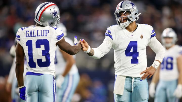 Nov 12, 2023; Arlington, Texas, USA; Dallas Cowboys wide receiver Michael Gallup (13) and quarterback Dak Prescott (4) celebrate a touchdown in the third quarter against the New York Giants at AT&T Stadium. 