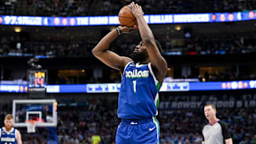 Apr 9, 2023; Dallas, Texas, USA; Dallas Mavericks guard Theo Pinson (1) makes a three point shot against the San Antonio Spurs during the second quarter at the American Airlines Center. Mandatory Credit: Jerome Miron-Imagn Images