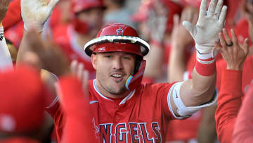 Apr 9, 2024; Anaheim, California, USA;  Los Angeles Angels outfielder Mike Trout (27) celebrates in the dugout after hitting a two run home run in the first inning against the Tampa Bay Rays at Angel Stadium. Mandatory Credit: Jayne Kamin-Oncea-USA TODAY Sports