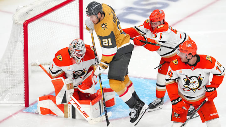May 12, 2026; Las Vegas, Nevada, USA; Anaheim Ducks goaltender Lukas Dostal (1) makes a save as defenseman Olen Zellweger (51) checks Vegas Golden Knights center Brett Howden (21) during an overtime period in game five of the second round of the 2026 Stanley Cup Playoffs at T-Mobile Arena. Mandatory Credit: Stephen R. Sylvanie-Imagn Images