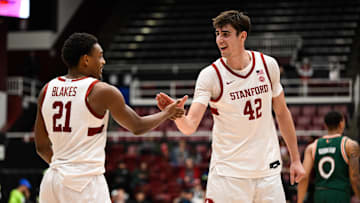 Jan 22, 2025; Stanford, California, USA; Stanford Cardinal forward Maxime Raynaud (42) and guard Jaylen Blakes (21) celebrate against the Miami (FL) Hurricanes in the second half at Maples Pavilion. Mandatory Credit: Eakin Howard-Imagn Images