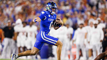 Oct 18, 2025; Lexington, Kentucky, USA; Kentucky Wildcats quarterback Cutter Boley (8) runs the ball during the first quarter against the Texas Longhorns at Kroger Field. Mandatory Credit: Jordan Prather-Imagn Images