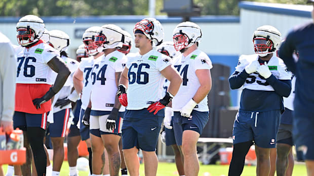 New England Patriots offensive tackle Will Campbell (66) look on before the start of drills.