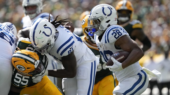 Sep 15, 2024; Green Bay, Wisconsin, USA;  Indianapolis Colts running back Jonathan Taylor (28) rushes with the football during the third quarter against the Green Bay Packers at Lambeau Field. Mandatory Credit: Jeff Hanisch-Imagn Images