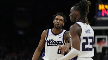 Feb 13, 2024; Phoenix, Arizona, USA; Sacramento Kings guard Malik Monk (0) and Sacramento Kings guard Keon Ellis (23) talk against the Phoenix Suns in the first half at Footprint Center. Mandatory Credit: Rick Scuteri-Imagn Images