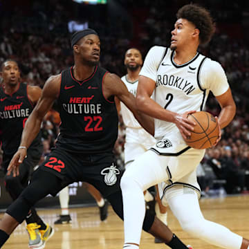 Nov 16, 2023; Miami, Florida, USA; Brooklyn Nets forward Cameron Johnson (2) drives to the basket as Miami Heat forward Jimmy Butler (22) defends  in the second half at Kaseya Center. Mandatory Credit: Jim Rassol-Imagn Images