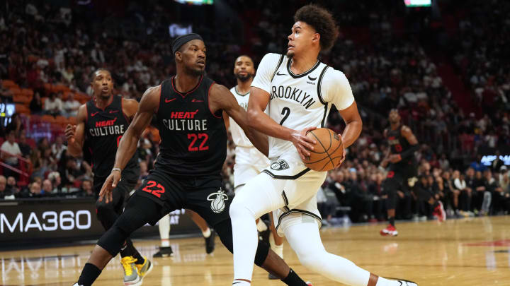 Nov 16, 2023; Miami, Florida, USA; Brooklyn Nets forward Cameron Johnson (2) drives to the basket as Miami Heat forward Jimmy Butler (22) defends  in the second half at Kaseya Center. Mandatory Credit: Jim Rassol-USA TODAY Sports