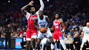 Dec 20, 2024; Philadelphia, Pennsylvania, USA; Charlotte Hornets forward Moussa Diabate (14) drives to shoot against Philadelphia 76ers center Andre Drummond (5) in the first quarter at Wells Fargo Center. Mandatory Credit: Kyle Ross-Imagn Images
