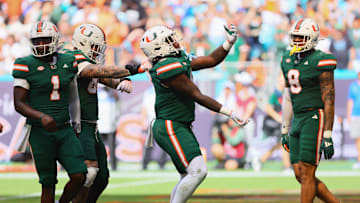 Nov 2, 2024; Miami Gardens, Florida, USA; Miami Hurricanes tight end Elija Lofton (9) celebrates after scoring a touchdown against the Duke Blue Devils during the third quarter at Hard Rock Stadium. Mandatory Credit: Sam Navarro-Imagn Images