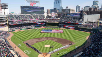 The national anthem is performed before the game between Twins.
