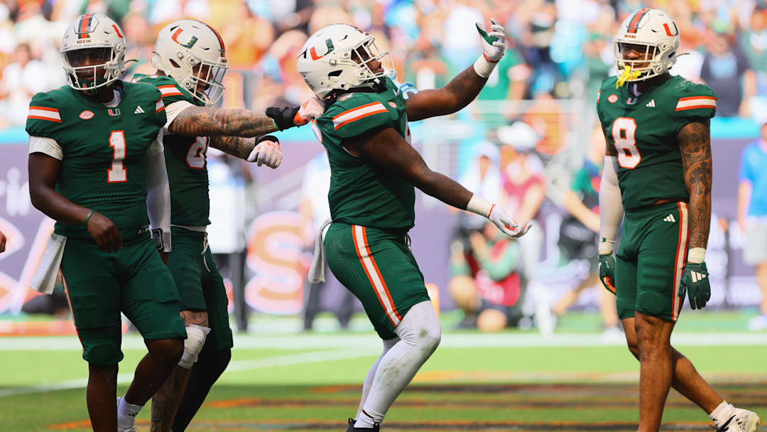 Nov 2, 2024; Miami Gardens, Florida, USA; Miami Hurricanes tight end Elija Lofton (9) celebrates after scoring a touchdown against the Duke Blue Devils during the third quarter at Hard Rock Stadium. Mandatory Credit: Sam Navarro-Imagn Images