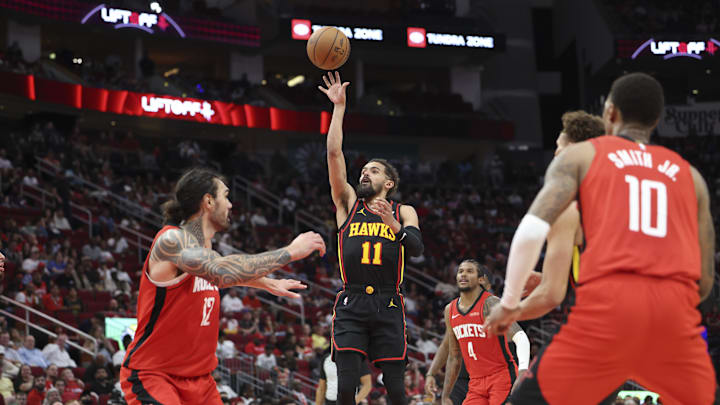 Mar 25, 2025; Houston, Texas, USA; Atlanta Hawks guard Trae Young (11) shoots the ball during the fourth quarter against the Houston Rockets at Toyota Center. Mandatory Credit: Troy Taormina-Imagn Images