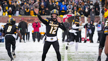 Nov 30, 2024; Columbia, Missouri, USA; Missouri Tigers quarterback Brady Cook (12) throws a pass against the Arkansas Razorbacks during the first half at Faurot Field at Memorial Stadium. Mandatory Credit: Denny Medley-Imagn Images