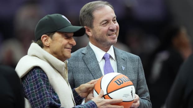 Golden State Valkyries owners Peter Guber and Joe Lacob pose for a photo.
