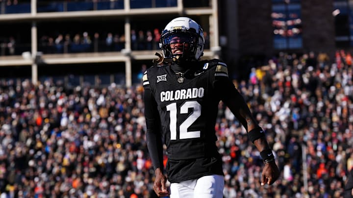 Nov 29, 2024; Boulder, Colorado, USA; Colorado Buffaloes wide receiver Travis Hunter (12) reacts in the first quarter against the Oklahoma State Cowboys at Folsom Field. Mandatory Credit: Ron Chenoy-Imagn Images