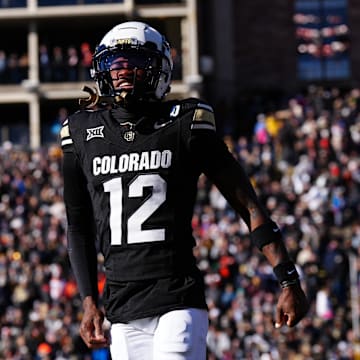 Nov 29, 2024; Boulder, Colorado, USA; Colorado Buffaloes wide receiver Travis Hunter (12) reacts in the first quarter against the Oklahoma State Cowboys at Folsom Field. Mandatory Credit: Ron Chenoy-Imagn Images