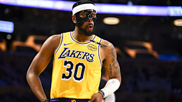 Apr 11, 2025; Los Angeles, California, USA; Los Angeles Lakers guard Jordan Goodwin (30) reacts against the Houston Rockets during the first half at Crypto.com Arena. Mandatory Credit: Jonathan Hui-Imagn Images