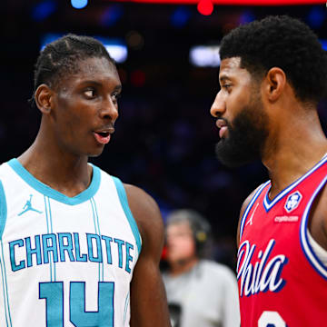 Hornets forward Moussa Diabate talks with Paul George after a game last season. 