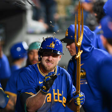 Seattle Mariners left fielder Luke Raley celebrates in the dugout after hitting a two-run home run against the Texas Rangers on Saturday at T-Mobile Park.