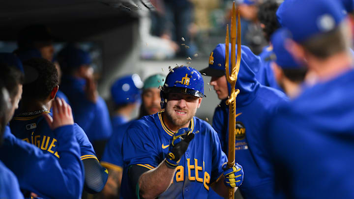 Seattle Mariners left fielder Luke Raley celebrates in the dugout after hitting a two-run home run against the Texas Rangers on Saturday at T-Mobile Park.