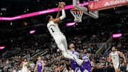 Oct 10, 2025; San Antonio, Texas, USA; San Antonio Spurs forward Victor Wembanyama (1) dunks on an alley-oop during the first half against the Utah Jazz at Frost Bank Center. 