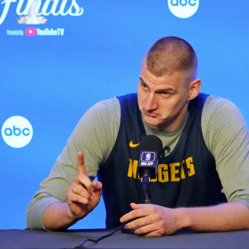 May 31, 2023; Denver, CO, USA; Denver Nuggets center Nikola Jokic (15) gestures as he talks to the media on media day before the 2023 NBA Finals at Ball Arena. 