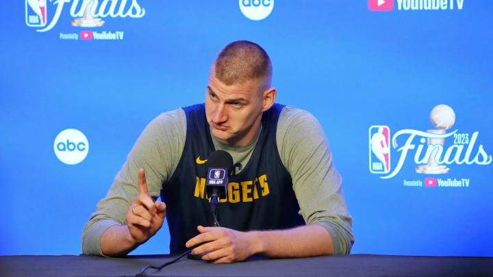 May 31, 2023; Denver, CO, USA; Denver Nuggets center Nikola Jokic (15) gestures as he talks to the media on media day before the 2023 NBA Finals at Ball Arena. 