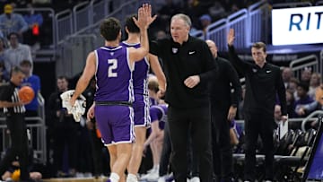 Dec 14, 2023; Milwaukee, Wisconsin, USA;  St. Thomas (MN) Tommies head coach Johnny Tauer high fives guard Chase Ross (2) during the second half against the Marquette Golden Eagles at Fiserv Forum. Mandatory Credit: Jeff Hanisch-Imagn Images