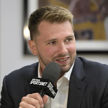 Aug 2, 2025; El Segundo, CA, USA; Los Angeles Lakers Luka Doncic  (77) is interviewed Spectrum SportsNet following a press conference announcing the signing of his contract extension at UCLA Health Training Center. Mandatory Credit: Jayne Kamin-Oncea-Imagn Images