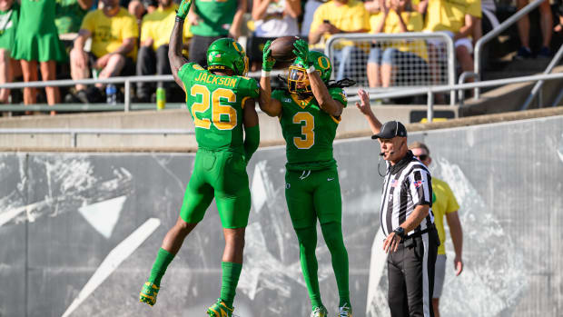 Oregon Ducks defensive back Brandon Johnson (3) celebrates an interception with linebacker Devon Jackson 