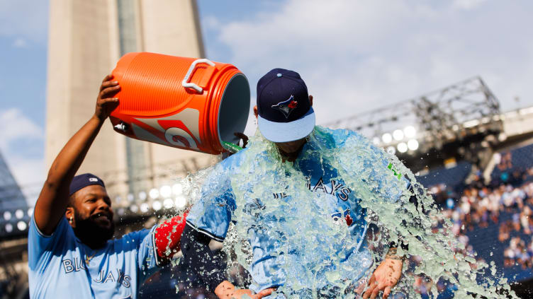 Vladimir Guerrero Jr. pouring gatorade on Bowden Francis after a 3-1 victory against the Los Angeles Angels on August 24th