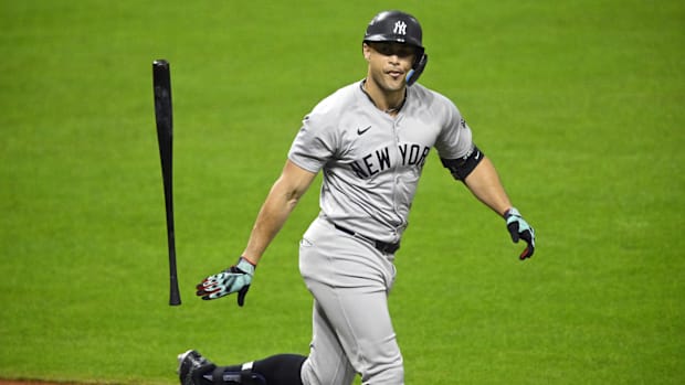 Giancarlo Stanton runs after hitting a three-run home run.