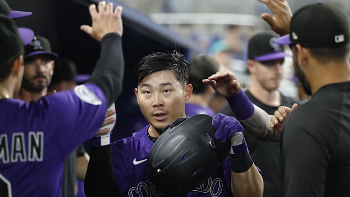 Jun 2, 2025; Miami, Florida, USA; Colorado Rockies first baseman Keston Hiura (7) is greeted teammates in the dugout after scoring against the Miami Marlins during the ninth inning at loanDepot Park. Jun 2, 2025; Miami, Florida, USA; Colorado Rockies first baseman Keston Hiura (7) is greeted teammates in the dugout after scoring against the Miami Marlins during the ninth inning at loanDepot Park.