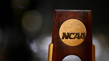 Apr 19, 2025; Fort Worth, TX, USA; A view of the NCAA logo and trophy before the 2025 Women's National Gymnastics Championship at Dickies Arena. Mandatory Credit: Jerome Miron-Imagn Images