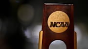 A view of the NCAA logo and trophy before the 2025 Women's National Gymnastics Championship at Dickies Arena.