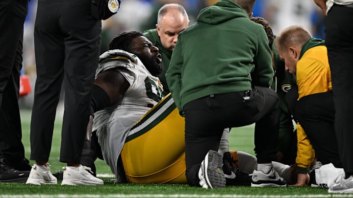 Nov 27, 2025; Detroit, Michigan, USA; Green Bay Packers defensive tackle Devonte Wyatt (95) is looked at after an injury against the Detroit Lions during the third quarter at Ford Field. 