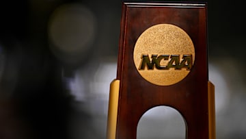 Apr 19, 2025; Fort Worth, TX, USA; A view of the NCAA logo and trophy before the 2025 Women's National Gymnastics Championship at Dickies Arena. Mandatory Credit: Jerome Miron-Imagn Images