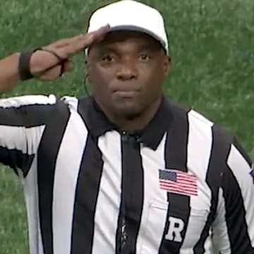 College football referee salutes U.S. military vets during bowl game