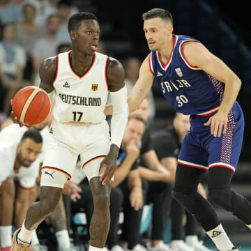 Aug 10, 2024; Paris, France; Germany point guard Dennis Schroder (17) controls the ball against Serbia point guard Aleksa Avramovic (30) in the men's basketball bronze medal game during the Paris 2024 Olympic Summer Games at Accor Arena. Mandatory Credit: Kyle Terada-USA TODAY Sports