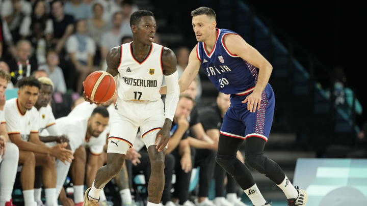 Aug 10, 2024; Paris, France; Germany point guard Dennis Schroder (17) controls the ball against Serbia point guard Aleksa Avramovic (30) in the men's basketball bronze medal game during the Paris 2024 Olympic Summer Games at Accor Arena. Mandatory Credit: Kyle Terada-USA TODAY Sports