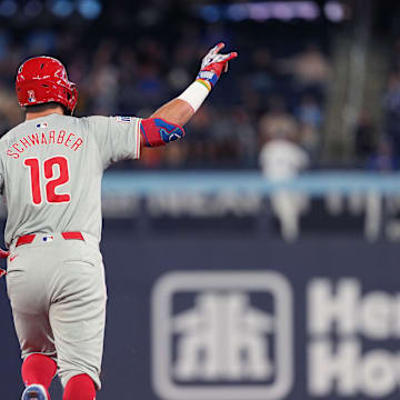 Philadelphia Phillies designated hitter Kyle Schwarber (12) celebrates after hitting a three-run home run against the Toronto Blue Jays during the ninth inning at Rogers Centre on Sept 3.