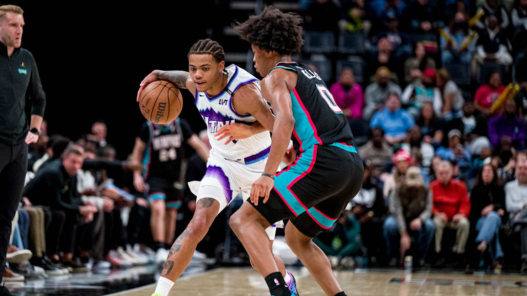 Dec 12, 2025; Memphis, Tennessee, USA; Utah Jazz guard Keyonte George (3) drives into defender Memphis Grizzlies forward Jalen Wells (0) in the second half at FedExForum. Mandatory Credit: Matthew Smith-Imagn Images
