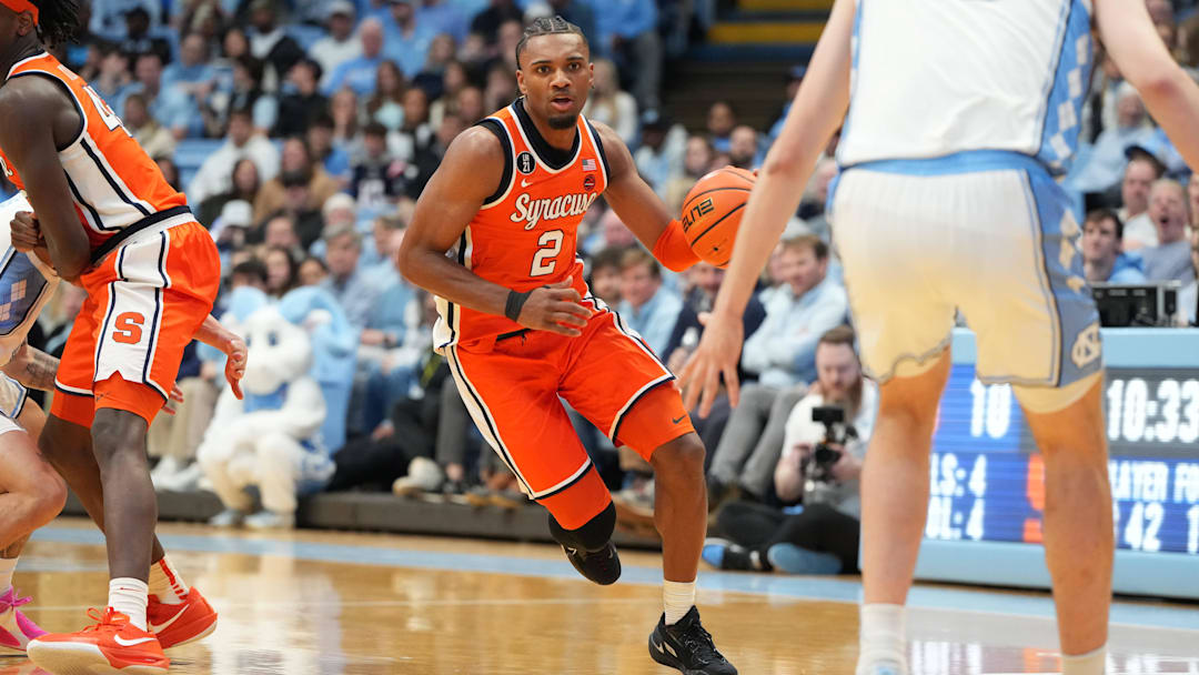 Feb 2, 2026; Chapel Hill, North Carolina, USA;  Syracuse Orange guard JJ Starling (2) dribbles as North Carolina Tar Heels center Henri Veesaar (13) defends in the first half at Dean E. Smith Center. Mandatory Credit: Bob Donnan-Imagn Images