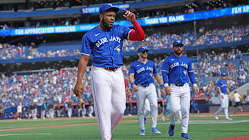 Sep 29, 2024; Toronto, Ontario, CAN; Toronto Blue Jays designated hitter Vladimir Guerrero Jr. (27) walks back to the dugout before the start of a game against the Miami Marlins at Rogers Centre. Mandatory Credit: Nick Turchiaro-Imagn Images