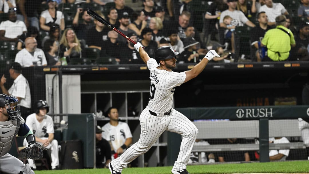 Jul 26, 2024; Chicago, Illinois, USA;  Chicago White Sox shortstop Paul DeJong (29) hits a double against the Seattle Mariners during the seventh inning at Guaranteed Rate Field.