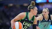 Jul 30, 2025; Minneapolis, Minnesota, USA; Minnesota Lynx guard Kayla McBride (21) dribbles against the New York Liberty in the second quarter at Target Center. Mandatory Credit: Brad Rempel-Imagn Images
